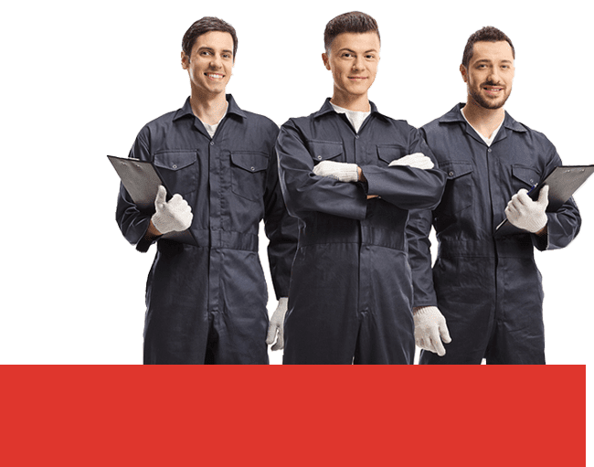A full shot of three smiling auto mechanics in a gray suit holding a clipboard.
