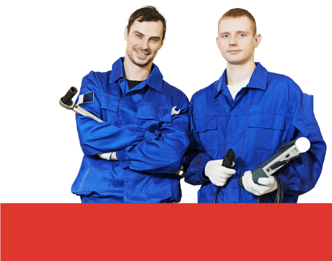 A full shot of two auto mechanics in a blue suit holding tools in both hands.