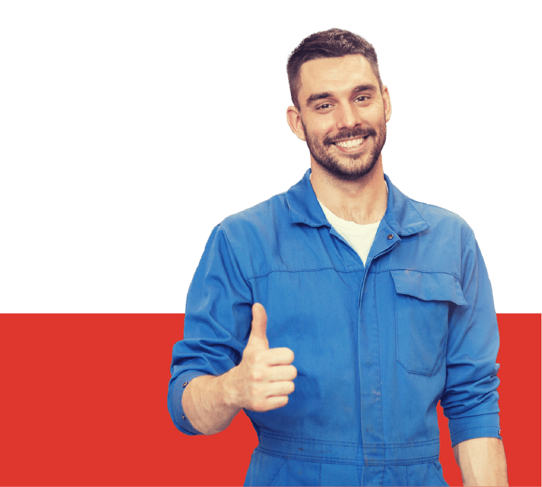 A full shot of a bearded auto mechanic in a blue suit doing a thumbs up gesture.